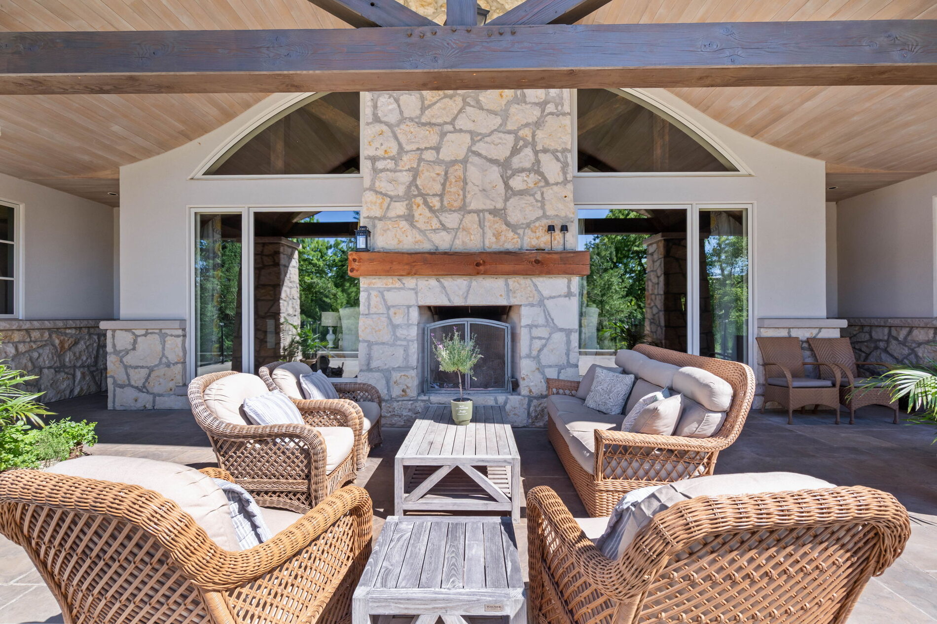 Covered terrace with stone fireplace